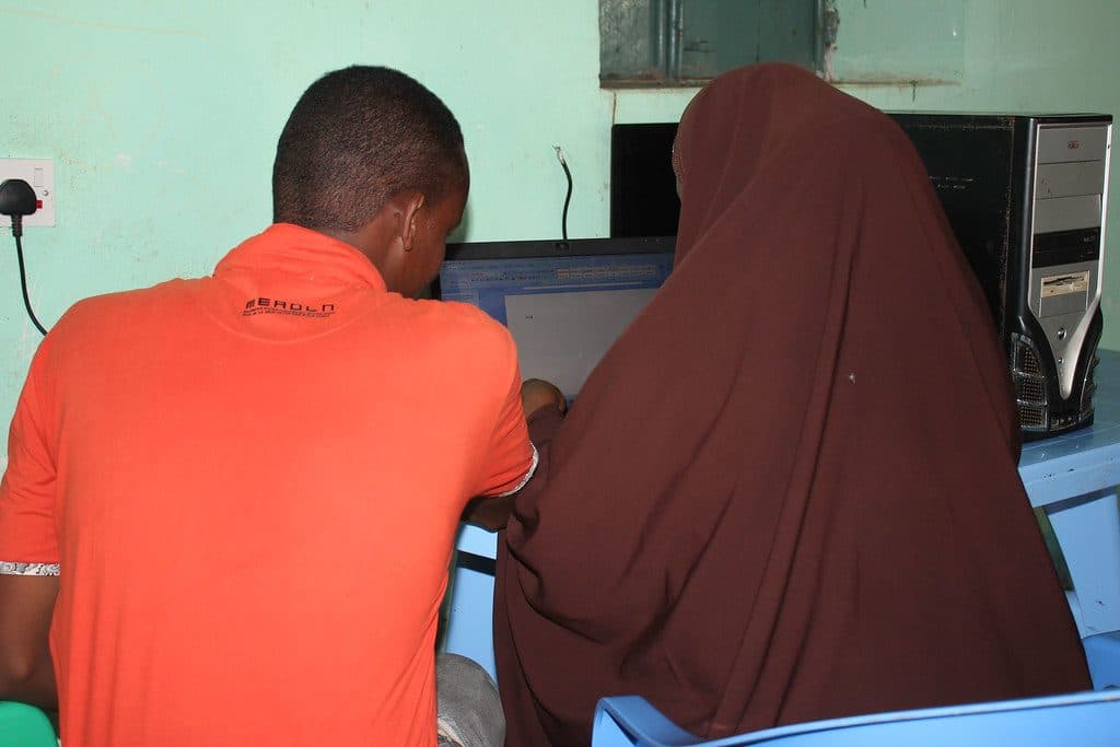 Colleagues working together at computers