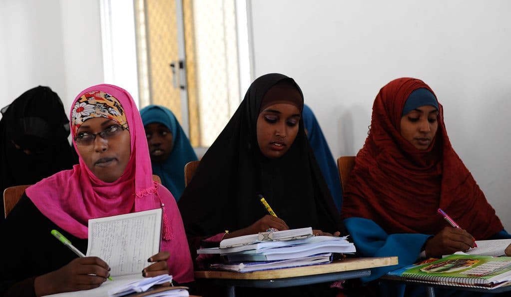 Students writing notes in a classroom